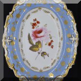 P45. Painted bowl with center rose and blue edge. 11” x 8” - $20 
